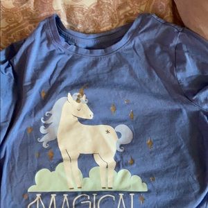 A blue shirt with a unicorn